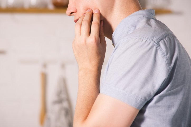 Man Suffering From A Toothache At Home