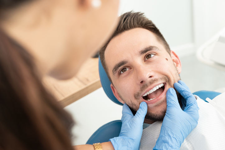 Man Having A Visit At The Dentist's