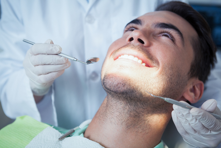 Close Up Of Man Having His Teeth Examined